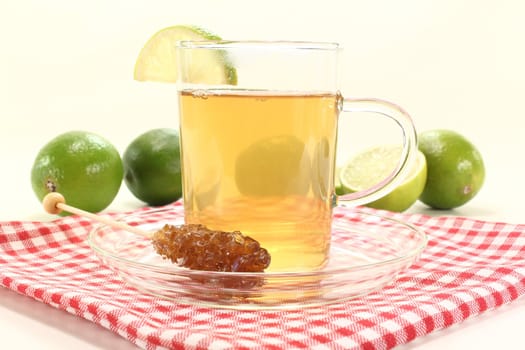 hot lemon tea in a glass with candy