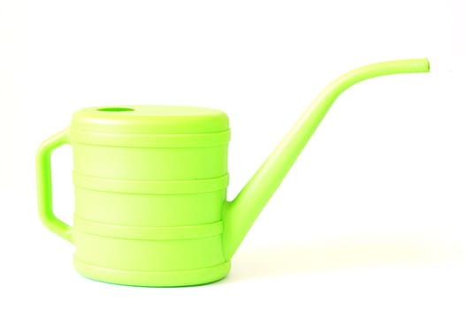 green watering can on white background