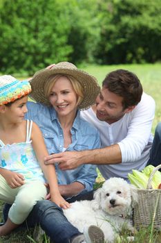 Family with small white dog