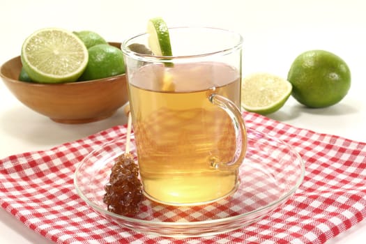 fresh lemon tea in a glass with candy