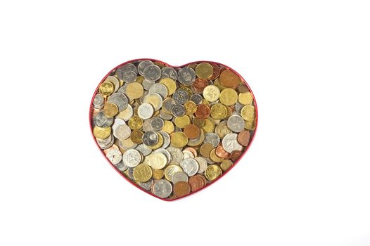 Coins from many countries in heart