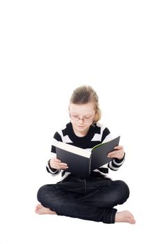 young girl reading a book isolated on white