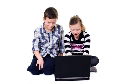 brother and sister using a computer isolated on white