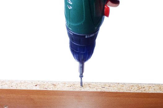 green cordless drill on white background