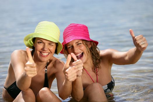 Two women bathing in the sea