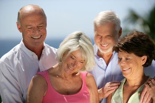 Two senior couples at the coast