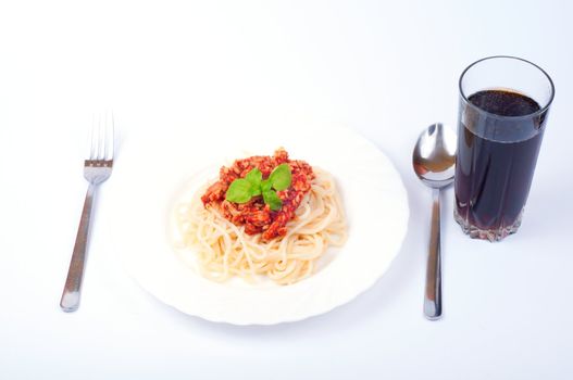 Saghetti on plate on white background