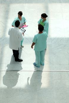 High angle view of a medical team chatting in an atrium