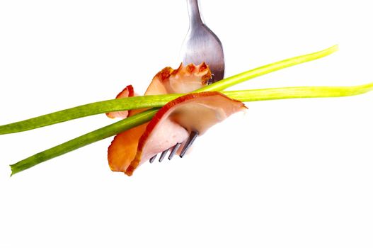 delicious sausage on a fork on white background