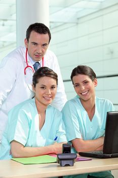 Physician and female nurses