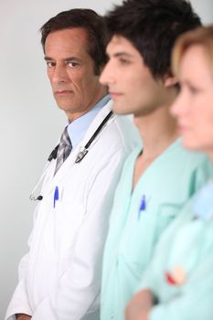 Doctor and nurses in a line