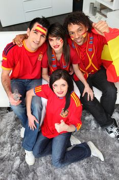 A group of friends supporting the Spanish football team