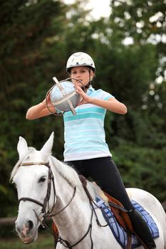 young woman playing horse-ball