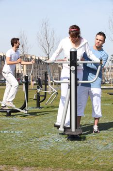 Young people using an outdoor gym