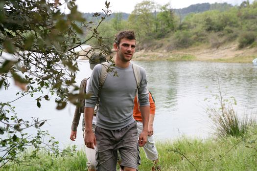 Group hiking by a lake