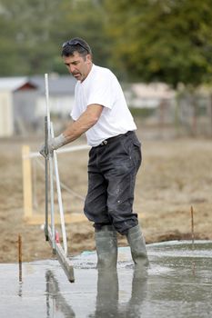 Construction worker using a technical tool