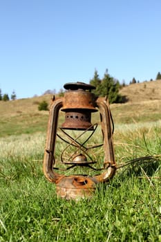 old rusty handlamp found in an abandoned village 
