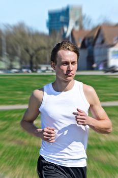 Motion Blur: Athletic young male running 
