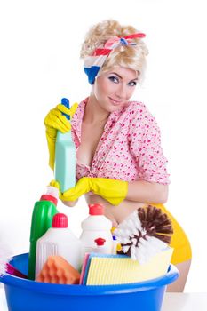 Pinup woman with cleaning set over white