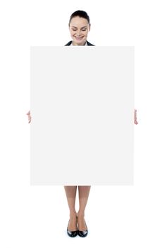 Business lady promoting big blank banner ad isolated on white