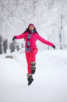 woman run in winter park very happy