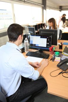 Office workers in front of computers