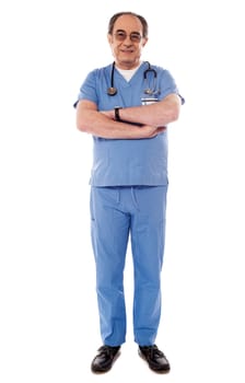 Experienced medical professional posing with folded arms isolated on white