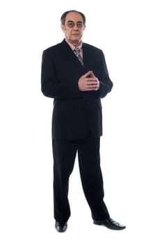 Elder businessman wearing glasses and posing in style against white background