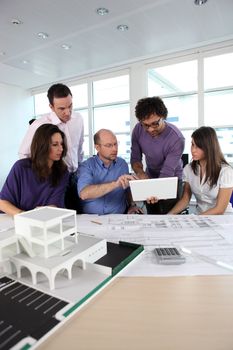 Group of people working in an architect's office