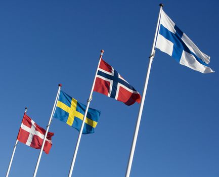 Scandinavian flags towards blue sky