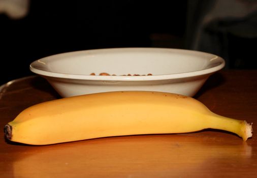 Unpeeled Banana Next to a Bowl of Soybeans