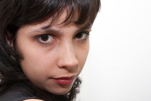 brunette girl on a white background. portrait