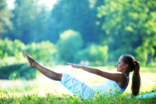  woman lay and training on ground 