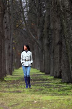 woman going by autumn park