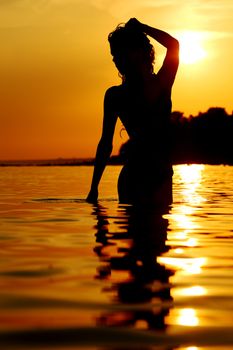 ocean woman in sunrise light