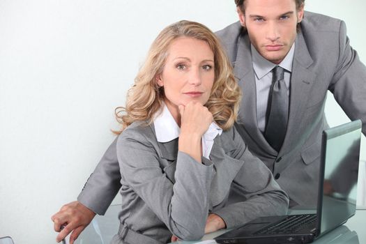 Executives with laptop computer