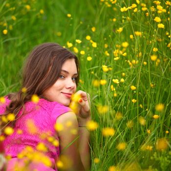 woman on flower field close portrait