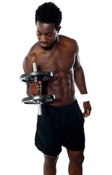 Young man doing biceps excercise. Isolated against white background