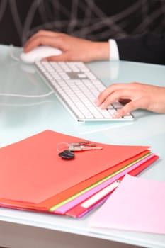 Businesswoman using a keyboard and mouse