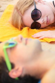 young girl watching young boy at the beach