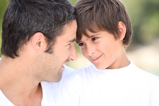 a father and his son looking each other in the eyes