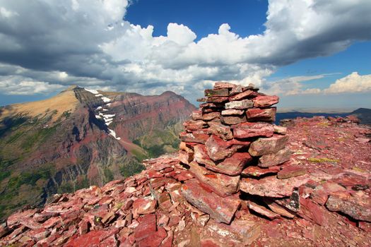 Rock cairn marking the summit of Mount Sinopah in Glacier National Park of Montana.