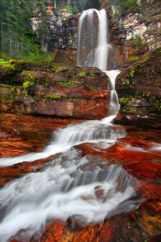 Beautiful Virginia Falls in the forests of Glacier National Park in northern Montana.