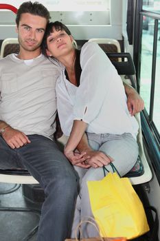 Couple embraced inside a bus