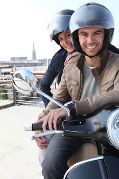 Young couple having a motorbike ride