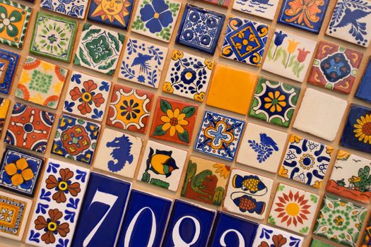Several rows of brightly colored ceramic tiles