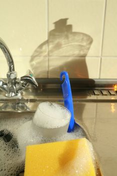 doing the dishes cleaning dirty dishes ...........