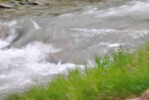 The photo shows a stream in Trentino. The blur was given in a manner intended to give a feeling of movement.