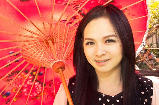 An image of a beautiful girl in the park of Thailand