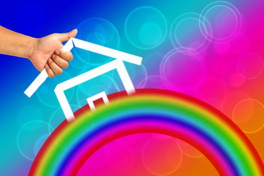 Hand and icon house with Rainbow